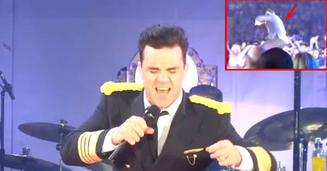 Robbie Williams se cae del escenario y le rompe el brazo a una fanática [Video]